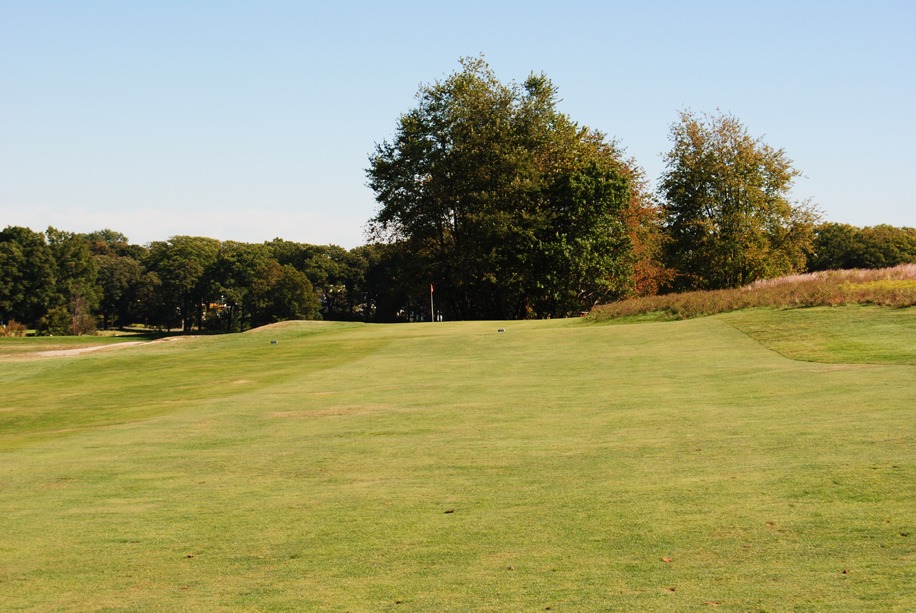 Sunny fairway leading to the green.